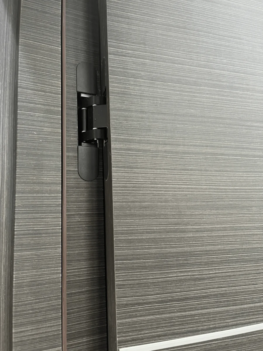 Concealed hinge on one of our doors, seen with the door slightly open